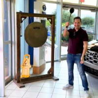 Man holding Gong Stick next to Gong